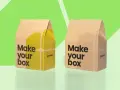 Dos cajas de cartón, una con diseño amarillo y la otra sin, ambas con el lema "Make your box".