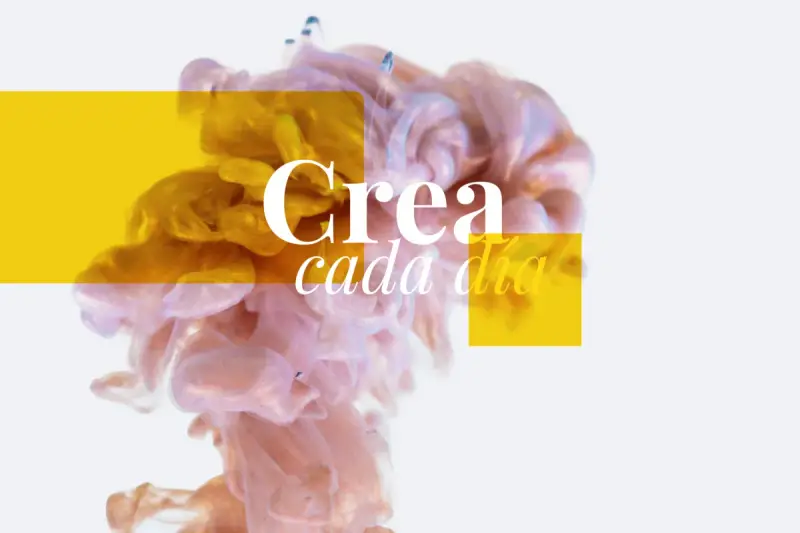 Nubes de tinta dorada y rosa se mezclan, con el texto "Crea cada día". Un ejemplo de trucos publicitarios para inspirar.
